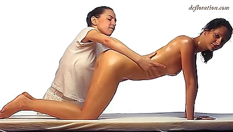 Two girls lick each other